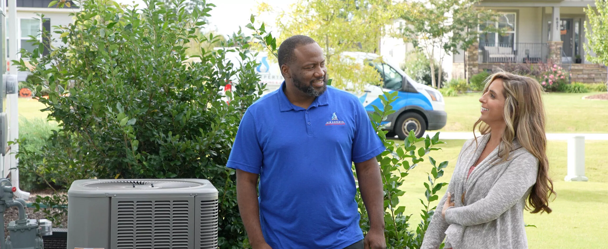 Air Experts technician talking to a homeowner in Raleigh, NC