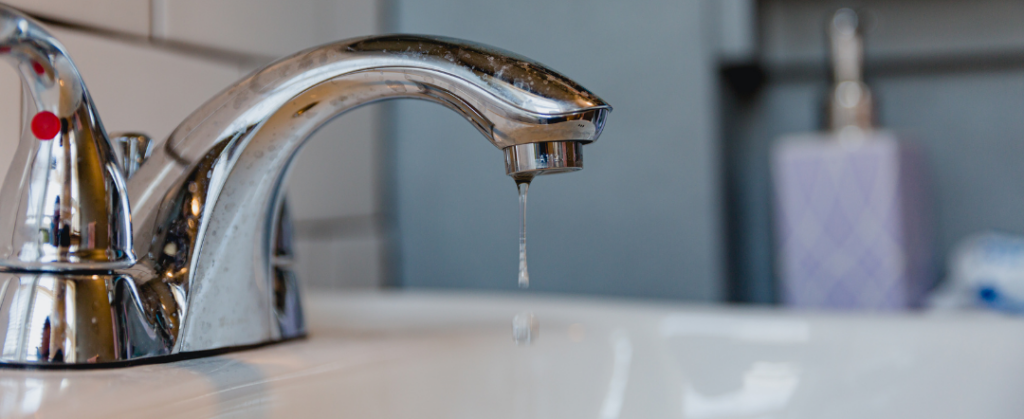 Stock photo of a faucet dripping in order to prevent frozen pipes during a really cold spell. Photo from Canva