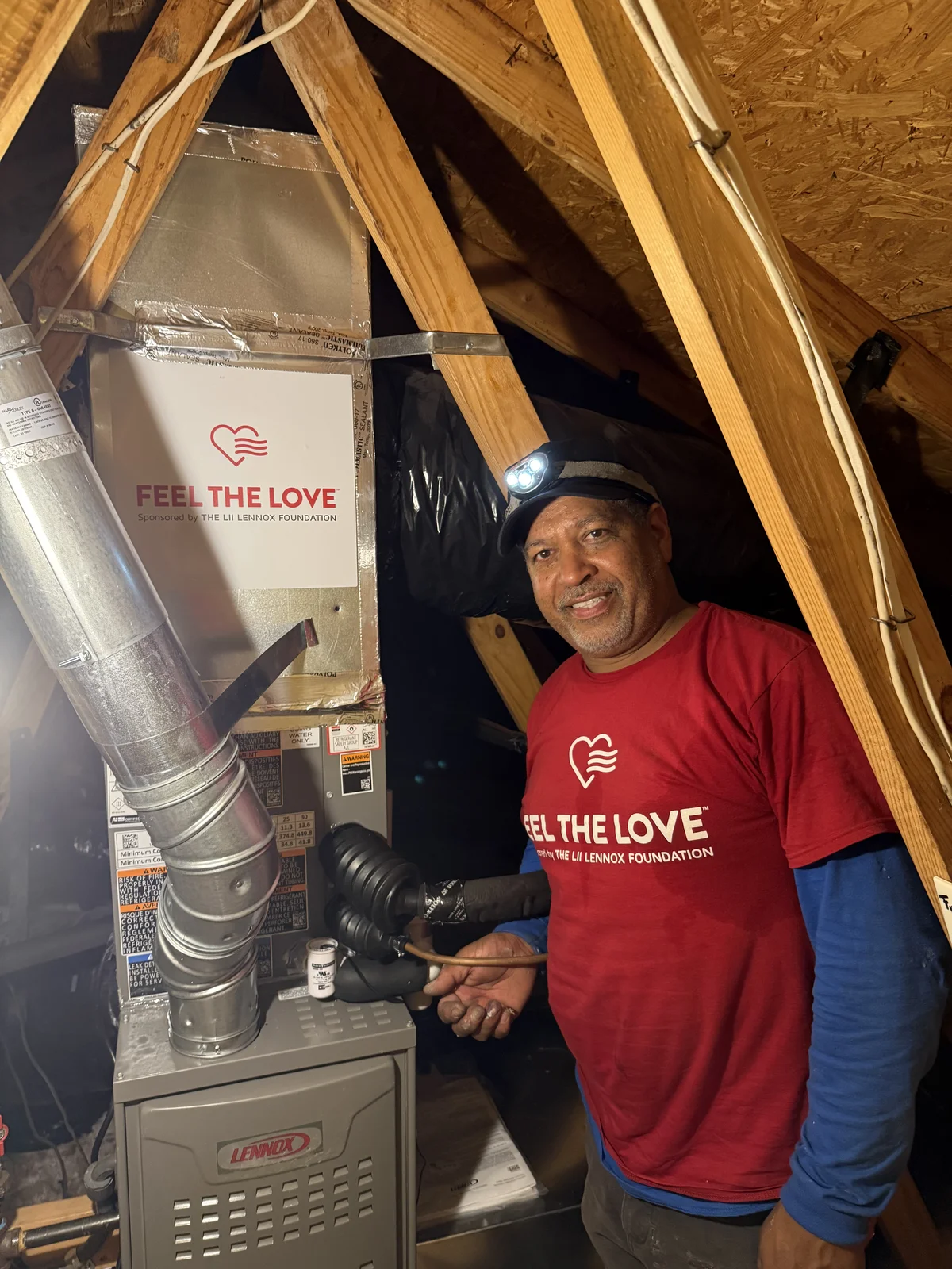 New Lennox furnace installed in the attic with Feel the Love branding visible